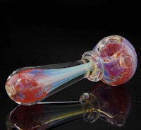 a glass pipe with a colorful flower on it